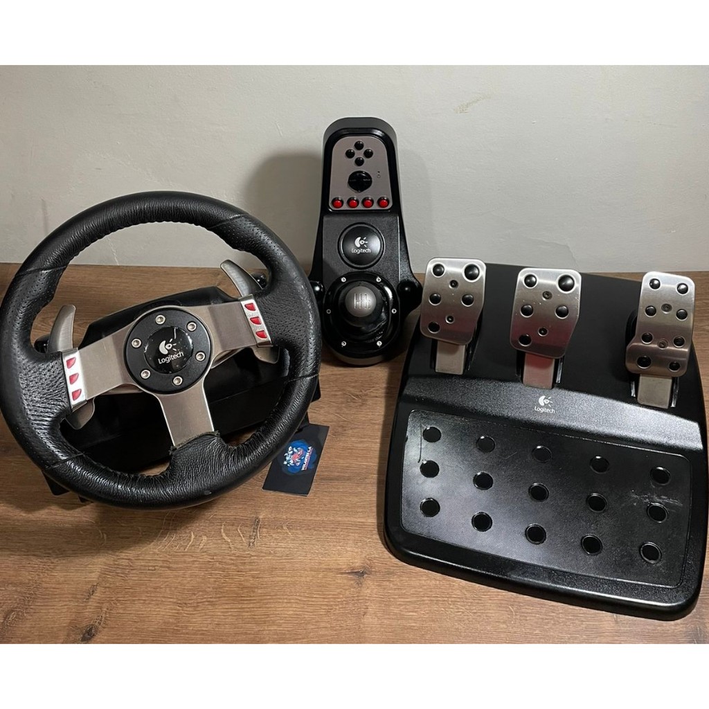 Volante Logitech G27 Driving Force C/ Pedal C/ Câmbio Ps2/Ps3/PC Completo + Garantia + Nota fiscal Volante Logitech G27 Driving Force C/ Pedal C/ Câmbio Ps2/Ps3/PC Completo + Garantia + Nota fiscal - Oferta na Shopee