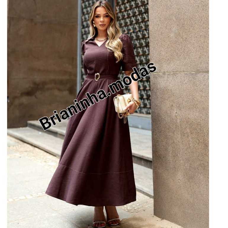 Vestido Midi femenino com Decote em V Gola Esportiva Manga 3/4 e Detalhe de Cinto em Fivela – Tendencia 2026 Vestido Midi femenino com Decote em V Gola Esportiva Manga 3/4 e Detalhe de Cinto em Fivela – Tendencia 2026